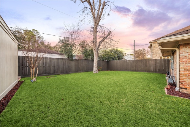 view of yard featuring a fenced backyard