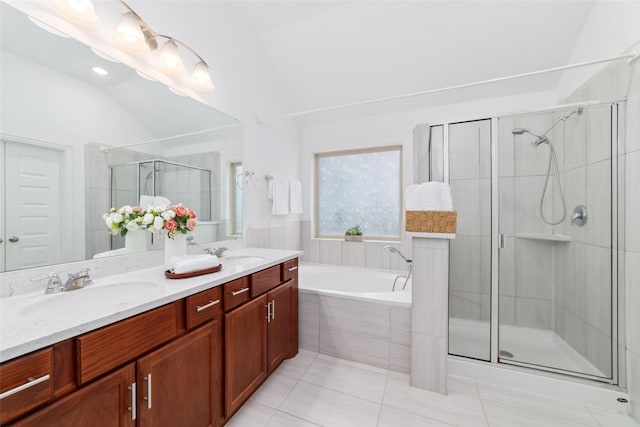 bathroom featuring double vanity, tile patterned flooring, a sink, and a shower stall