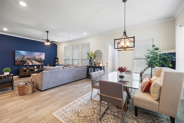 dining room featuring ceiling fan with notable chandelier, recessed lighting, light wood-type flooring, and crown molding