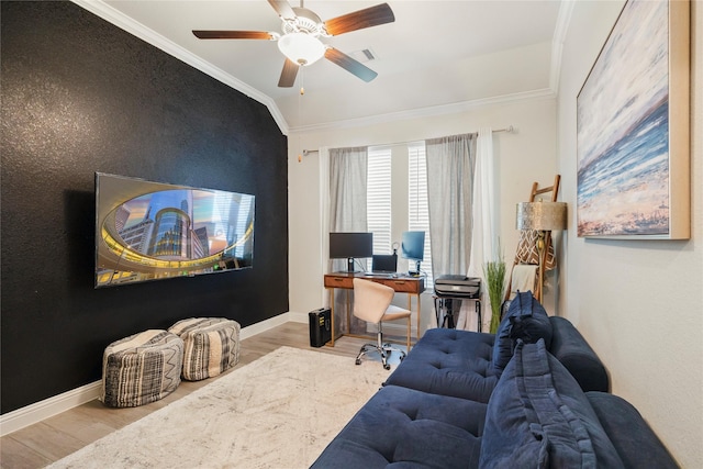 office area featuring visible vents, baseboards, light wood-style flooring, ceiling fan, and ornamental molding