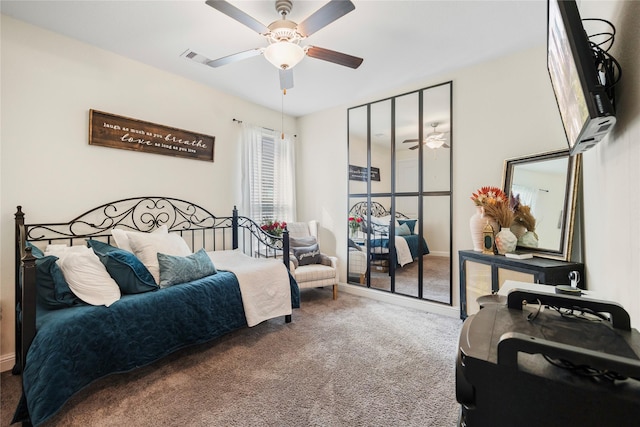 bedroom featuring carpet, visible vents, and a ceiling fan