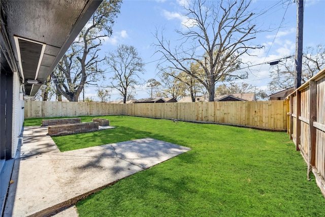 view of yard featuring a patio area and a fenced backyard