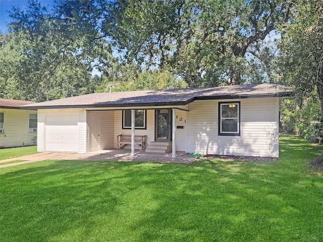 ranch-style house featuring a garage, driveway, and a front yard