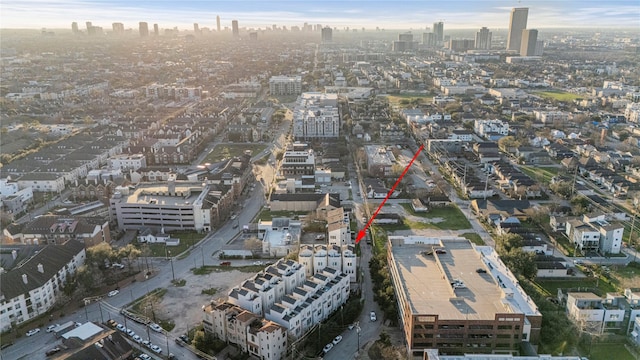 birds eye view of property featuring a city view
