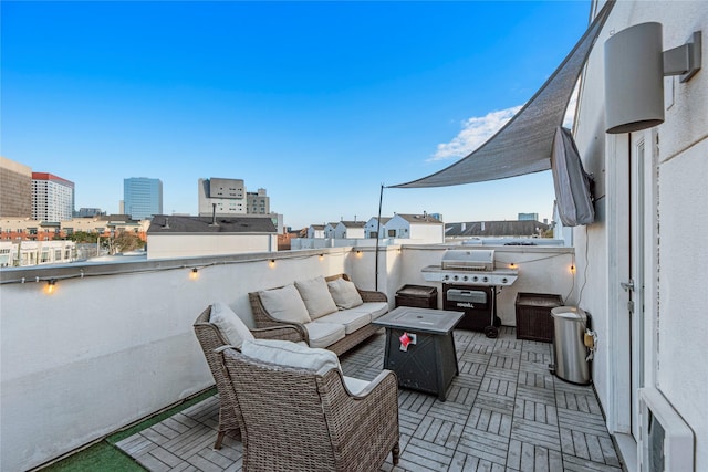 view of patio with grilling area and outdoor lounge area