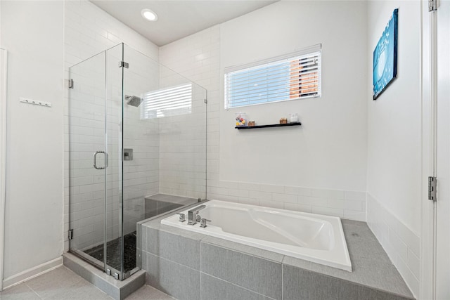 full bath featuring recessed lighting, a bath, and a stall shower