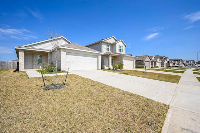 traditional home with brick siding, an attached garage, a front yard, a residential view, and driveway