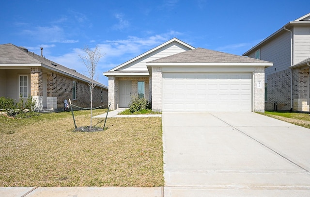 single story home featuring a garage, concrete driveway, brick siding, and a front lawn