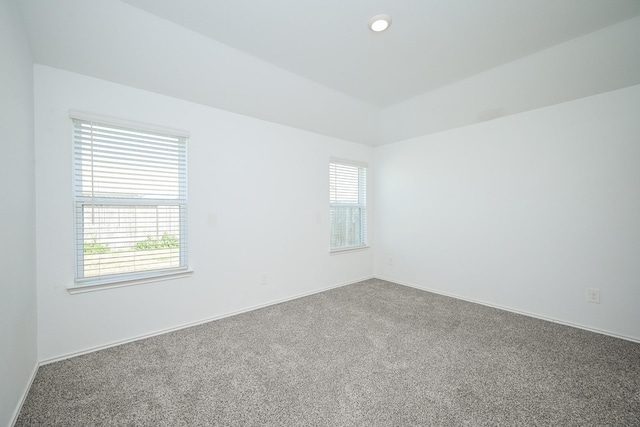 carpeted empty room featuring baseboards, recessed lighting, and a healthy amount of sunlight