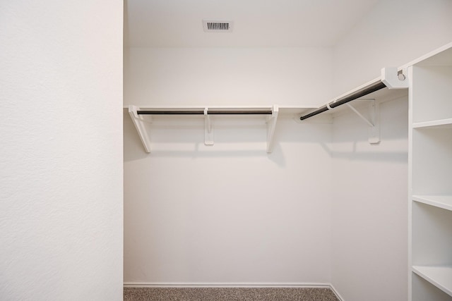 walk in closet featuring carpet floors and visible vents