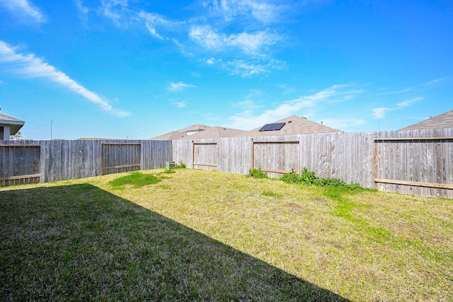 view of yard with a fenced backyard