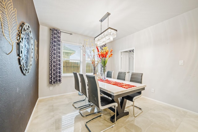 dining space with baseboards