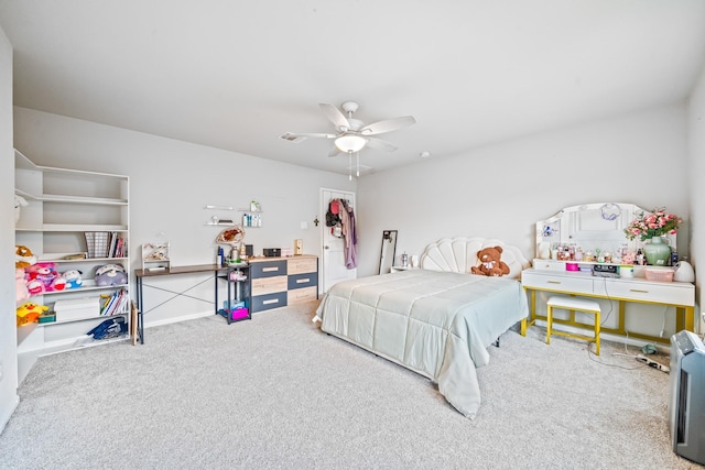 carpeted bedroom featuring a ceiling fan and baseboards