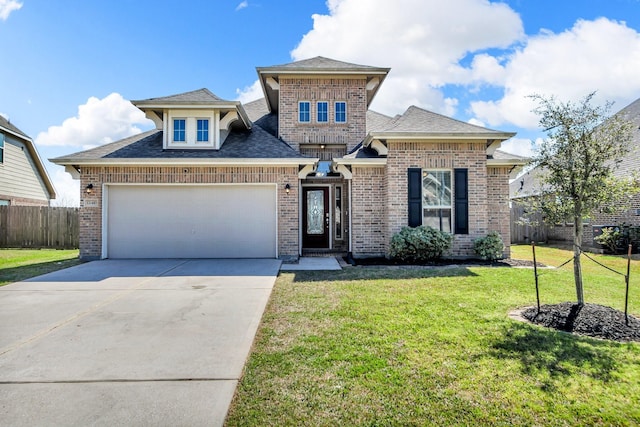 view of front of house with concrete driveway, an attached garage, fence, a front yard, and brick siding