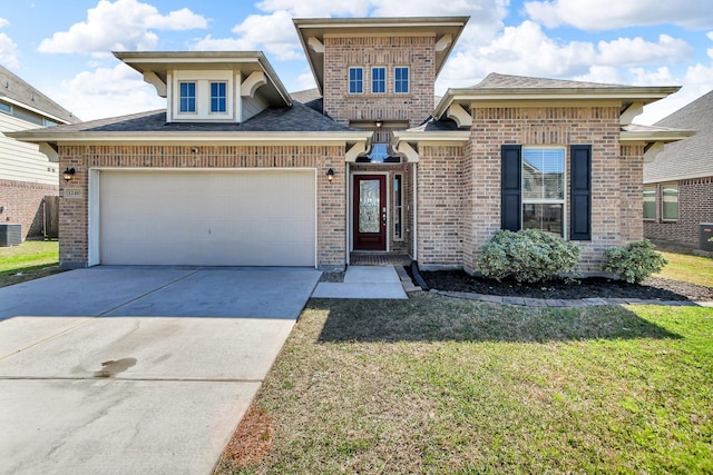 view of front facade with driveway, an attached garage, a front yard, central AC, and brick siding