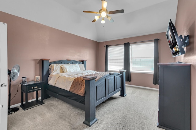 bedroom with light carpet, ceiling fan, baseboards, and lofted ceiling