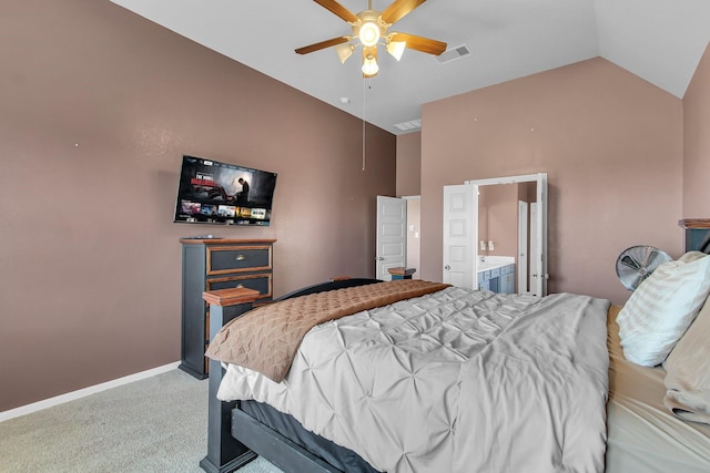 carpeted bedroom with baseboards, visible vents, lofted ceiling, ensuite bath, and ceiling fan