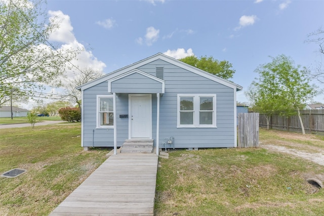 2430 5th Ave N, Texas City, TX 77590 - bungalow-style home featuring a front lawn and fence