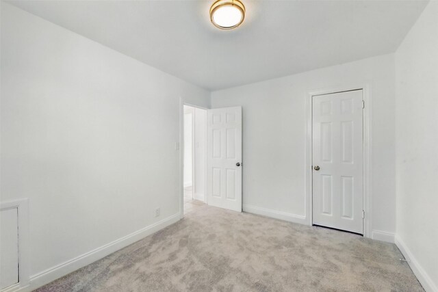2430 5th Ave N, Texas City, TX 77590 - spare room with baseboards and carpet flooring