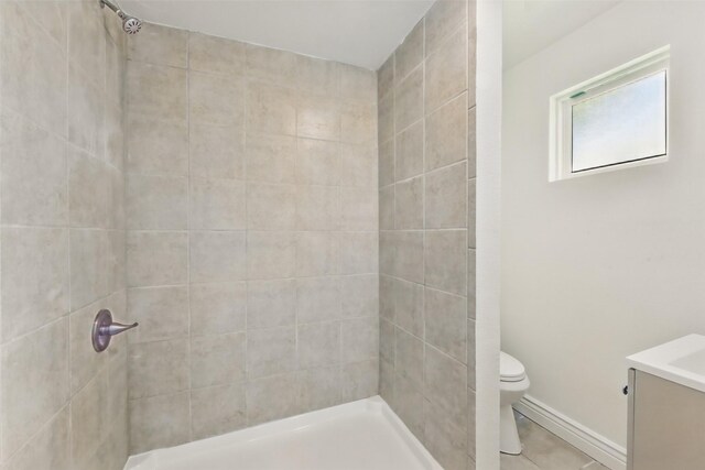 2430 5th Ave N, Texas City, TX 77590 - full bath featuring baseboards, toilet, vanity, and a tile shower
