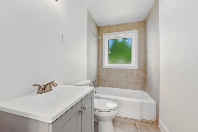 2430 5th Ave N, Texas City, TX 77590 - bathroom featuring tile patterned floors, toilet, vanity, and washtub / shower combination