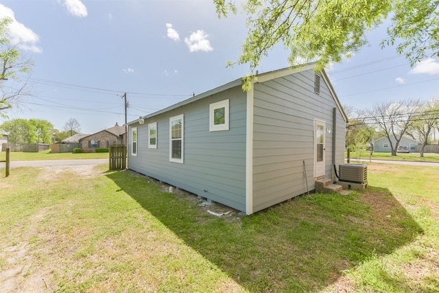 2430 5th Ave N, Texas City, TX 77590 - view of home's exterior with a yard and central AC unit