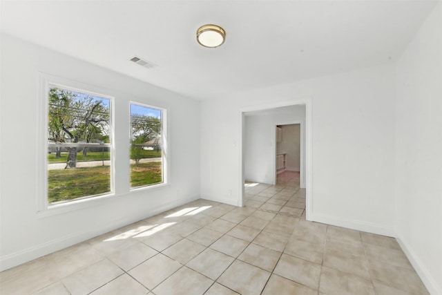 2430 5th Ave N, Texas City, TX 77590 - spare room featuring light tile patterned floors, baseboards, and visible vents