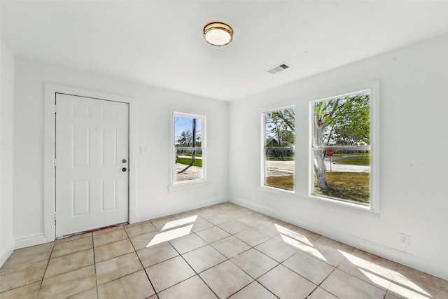 2430 5th Ave N, Texas City, TX 77590 - entryway with light tile patterned floors, visible vents, and baseboards