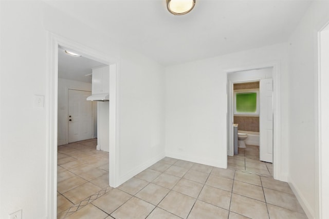 2430 5th Ave N, Texas City, TX 77590 - spare room featuring light tile patterned floors and baseboards