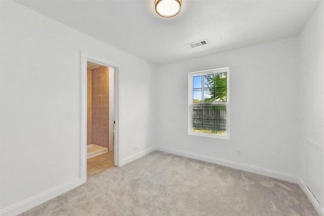 2430 5th Ave N, Texas City, TX 77590 - empty room featuring light colored carpet, visible vents, and baseboards