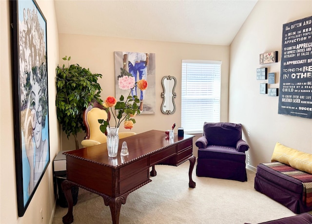 carpeted office space with vaulted ceiling