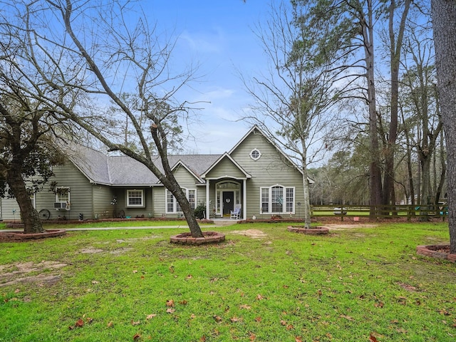 single story home featuring a front yard