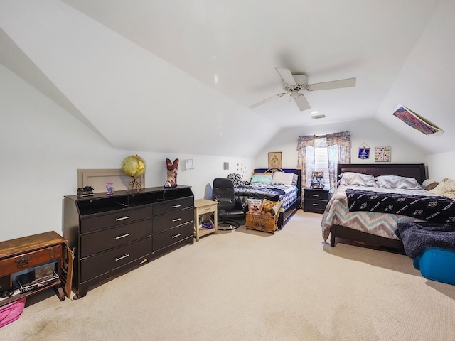 bedroom featuring carpet floors, ceiling fan, and lofted ceiling