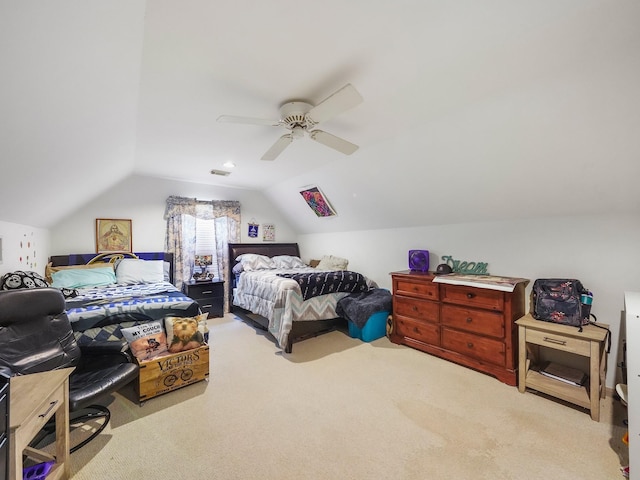 bedroom featuring vaulted ceiling, a ceiling fan, and light colored carpet