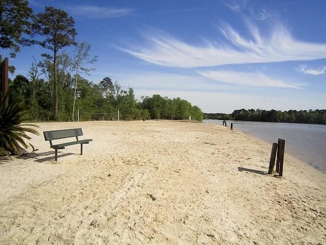 view of home's community featuring a water view and volleyball court