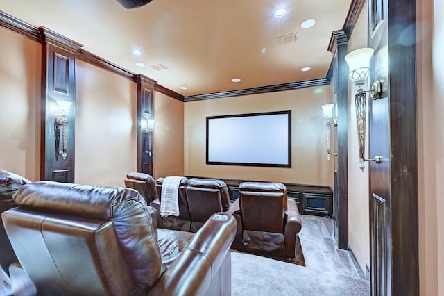 carpeted home theater room featuring ornamental molding, visible vents, and recessed lighting