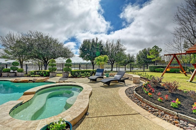 view of pool with a fenced backyard, playground community, an in ground hot tub, a fenced in pool, and a patio area