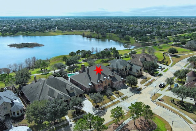 aerial view with a residential view and a water view