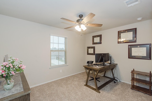 office featuring light colored carpet, visible vents, and baseboards