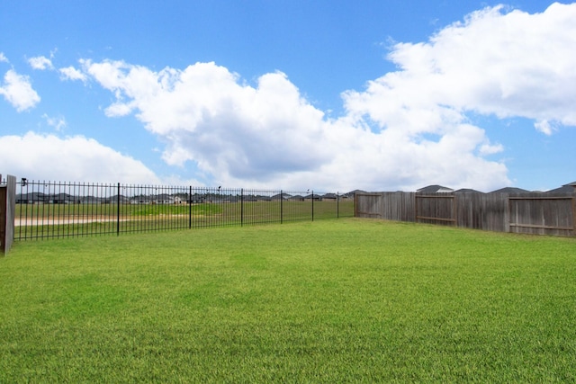 view of yard with a fenced backyard