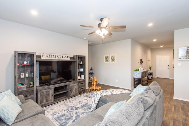 living room featuring baseboards, dark wood-style flooring, a ceiling fan, and recessed lighting