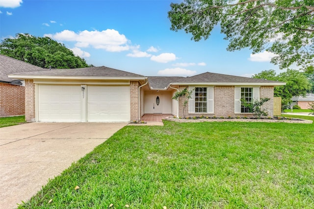 ranch-style house with driveway, a front lawn, and brick siding