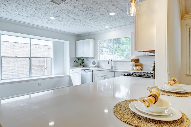 kitchen featuring a sink, light countertops, decorative backsplash, and dishwasher
