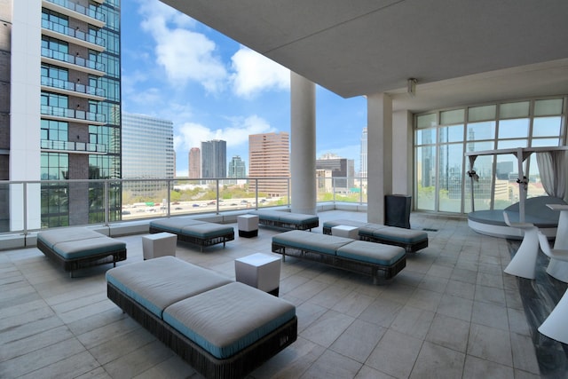 view of patio / terrace featuring a balcony and a city view