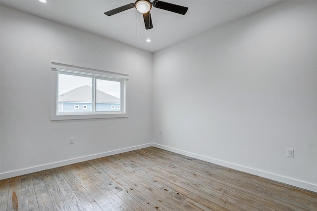 unfurnished room featuring a ceiling fan, recessed lighting, light wood-style flooring, and baseboards