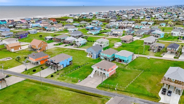 birds eye view of property with a water view and a residential view