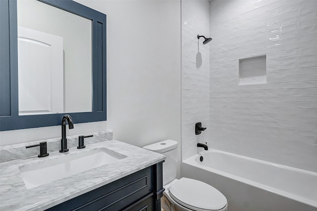 bathroom with toilet, washtub / shower combination, and vanity