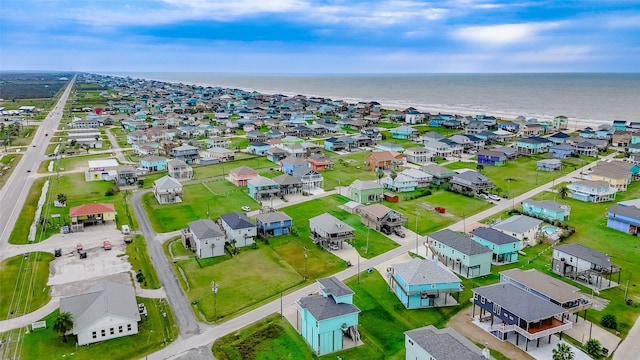 bird's eye view with a water view and a residential view