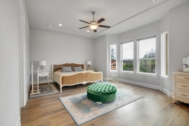 bedroom featuring recessed lighting, light wood-style flooring, and baseboards