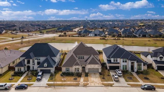 aerial view with a water view and a residential view